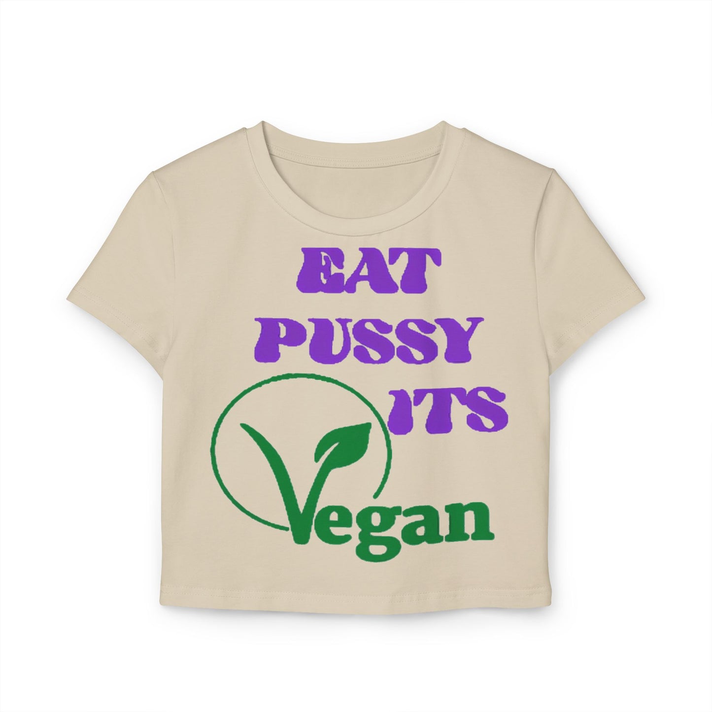 Chic beige cropped t-shirt showcasing a whimsical vegan-themed design that boldly states 'EAT PUSSY ITS Vegan' in vibrant purple and green lettering.