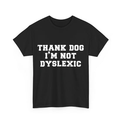 Sophisticated black cotton t-shirt for unisex, boldly presenting the phrase "THANK DOG I'M NOT DYSLEXIC" in clean white letters, suitable for fashion-conscious individuals.