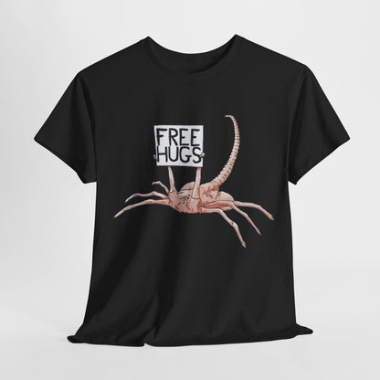 Alien Xenomorph Facehugger Free Hugs graphic unisex t-shirt in black, featuring a whimsical design of a facehugger holding a sign that reads 'Free Hugs'.