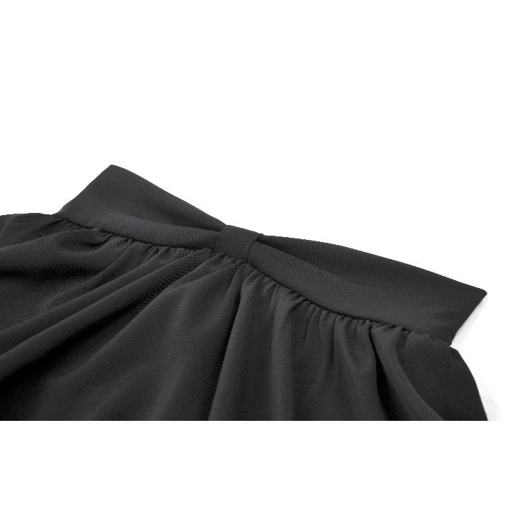 Detailed close-up of the layered frill detailing on a black Lolita-inspired mini skirt, exemplifying sophisticated alternative fashion.