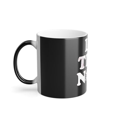 Stylish side view of the Let It Snow Le Tits Now Colour Morphing Mug, displaying its unique colour morphing feature when filled.