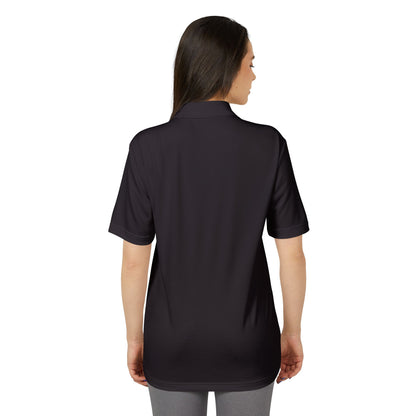 Back view of a model wearing the Adidas Unisex Performance Polo Shirt, accentuating the elegant simplicity and eco-friendly fabric in a sophisticated dark tone.