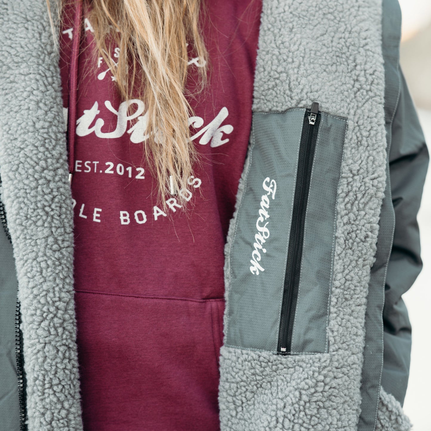 Stylish unisex waterproof changing robe 'FatWrap', perfect for effortless changing by the beach, demonstrating blend of functionality and luxury.