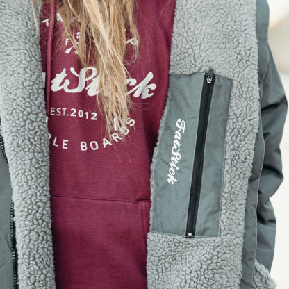 Stylish unisex waterproof changing robe 'FatWrap', perfect for effortless changing by the beach, demonstrating blend of functionality and luxury.