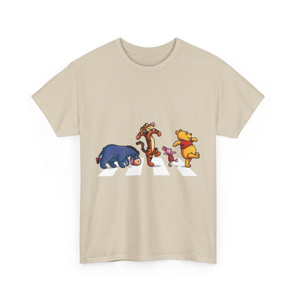 Front view of the Pooh and Friends Abbey Road Graphic T-Shirt in a beige colour, featuring beloved characters Winnie the Pooh, Tigger, Piglet, and Eeyore elegantly crossing Abbey Road, merging classic design with luxury fashion.