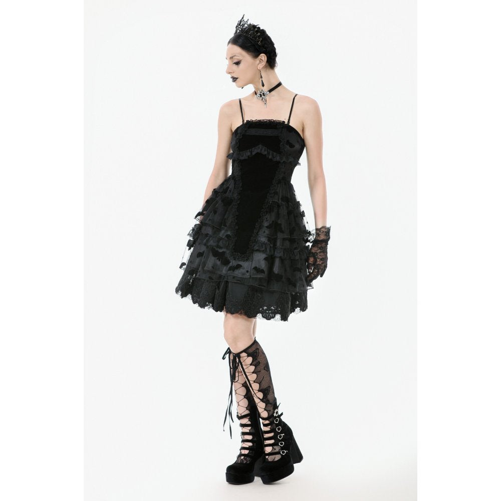 Model wearing the Dark in Love Morwenna Bat Mesh Layered Goth Mini Dress at a gothic event, highlighting its enchanting cut-out bust and playful ruffles.