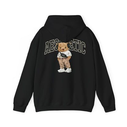 Elegant black hoodie adorned with a charming cartoon teddy bear graphic on the reverse, highlighted by the word 'AESTHETIC' in striking lettering, ideal for those seeking modern sophistication.