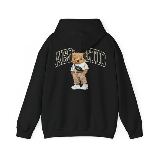 Elegant black hoodie adorned with a charming cartoon teddy bear graphic on the reverse, highlighted by the word 'AESTHETIC' in striking lettering, ideal for those seeking modern sophistication.