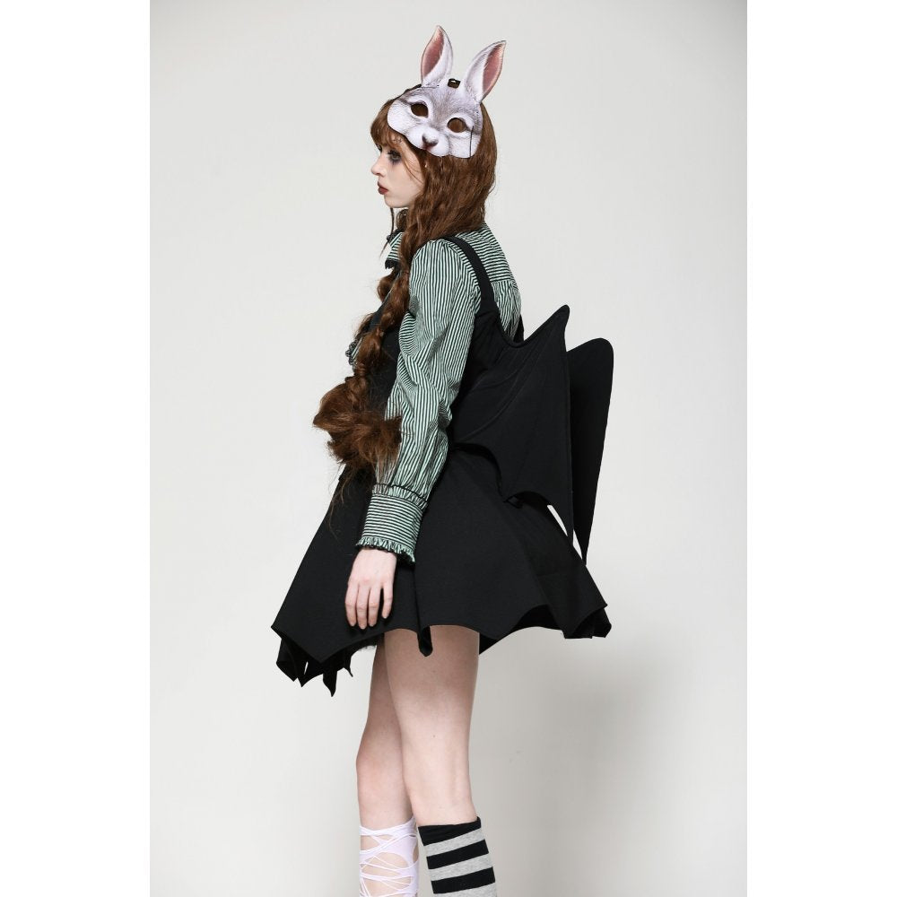 Model wearing the Dark in Love Vespertilio Vest, showcasing its unique garb and striking bat wing embellishments against a fashionable backdrop.