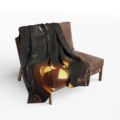 Luxurious decorative Halloween Arctic fleece blanket draped over a stylish armchair, showcasing a vibrant and spooky pumpkin design, perfect for cozy autumn evenings.
