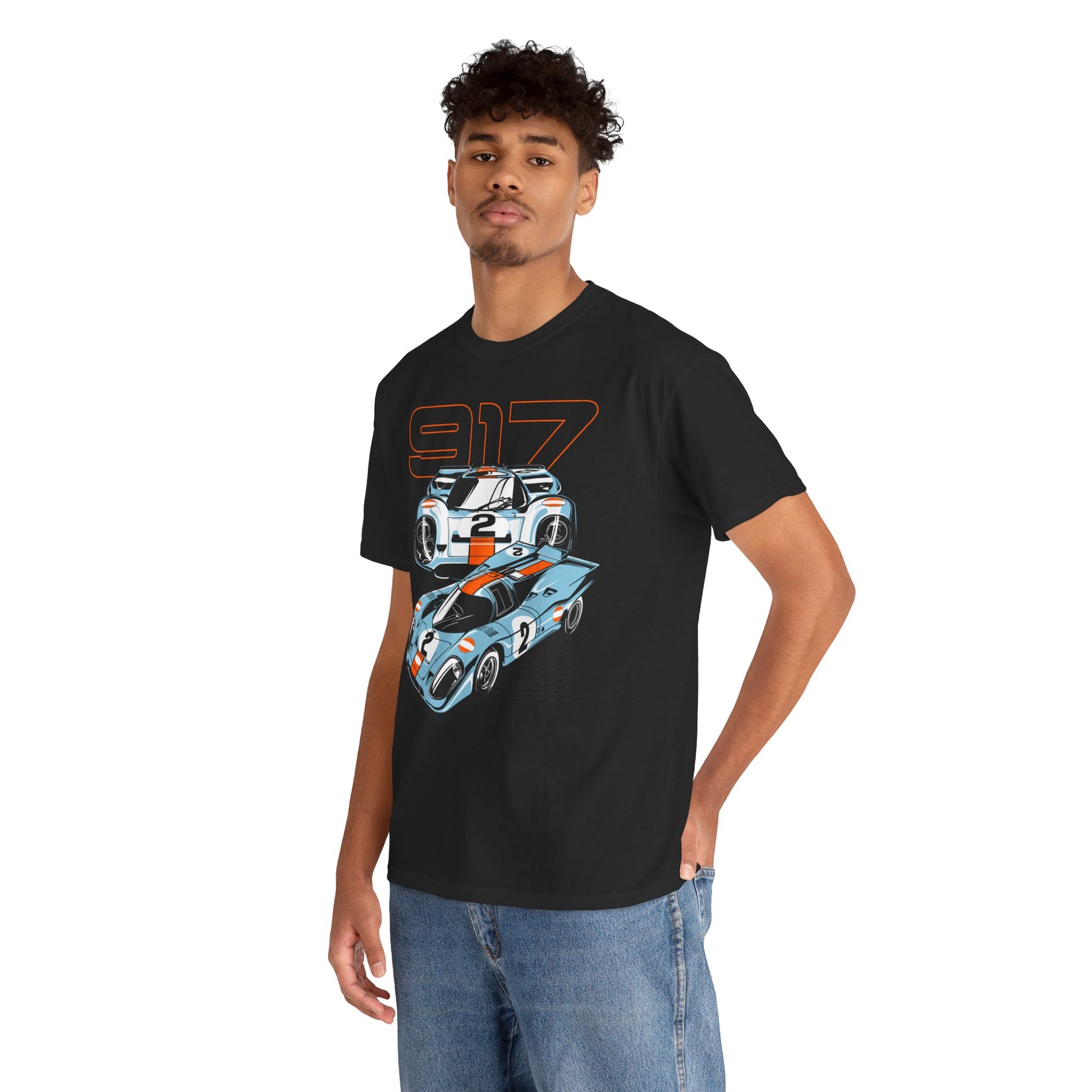 Model wearing a sophisticated black Porsche 917 graphic t-shirt, elegantly designed with striking race car graphics, capturing the essence of automotive luxury.