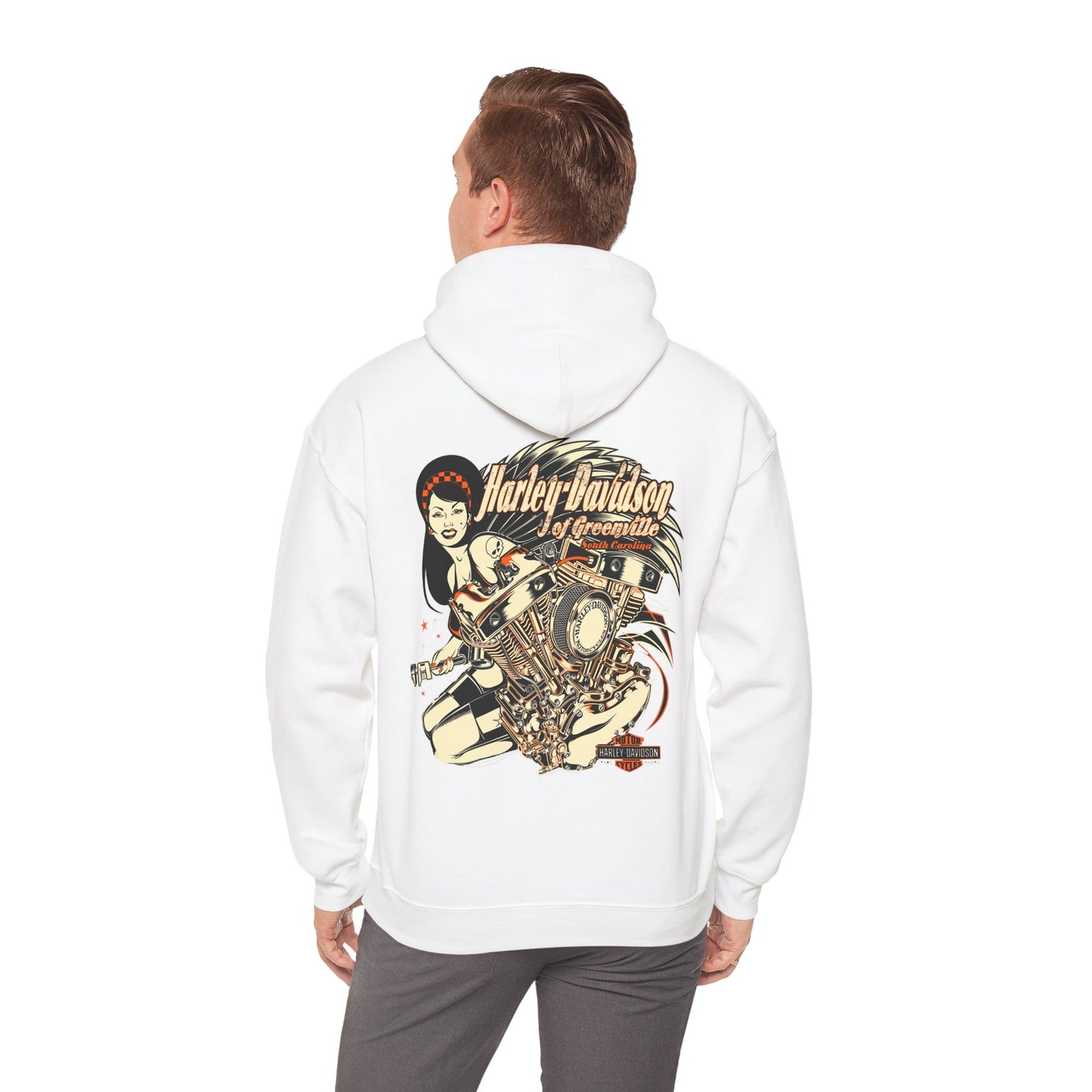 Stylish man wearing a white Harley-Davidson hoodie with a captivating back print, showcasing a powerful motorcycle engine and a poised woman, embodying luxury and adventure.