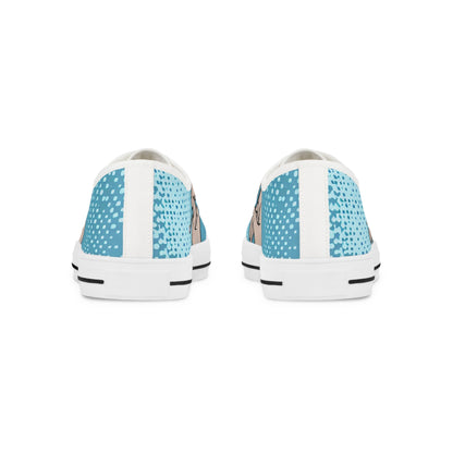 Close-up view of Zara Thunderstrike low top sneakers, featuring a striking bold blue canvas and delicate pastel pink pinstripes by Dazzling Dreams Studio.