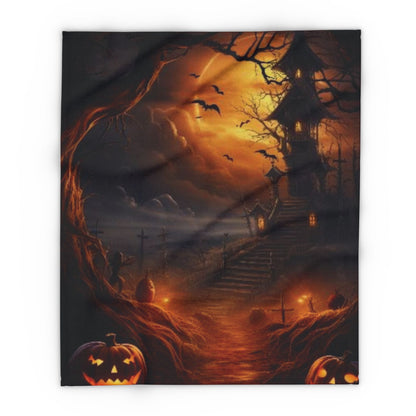 Decorative and Warm Halloween Spooky Arctic Fleece Blanket showcasing a captivating Halloween landscape with a mystical mansion illuminated by a crescent moon, complemented by sinister pumpkins and flying bats, ideal for a sophisticated holiday atmosphere.