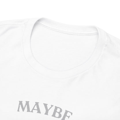 Close-up of the rounded neckline of a white t-shirt highlighting premium fabric and soft texture, featuring the playful 'Maybe Tomorrow' print in sophisticated grey.