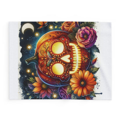 Decorative and Warm Halloween Skellington Spooky Arctic Fleece Blanket featuring a vibrant pumpkin skull design surrounded by flowers, perfect for festive home decor.