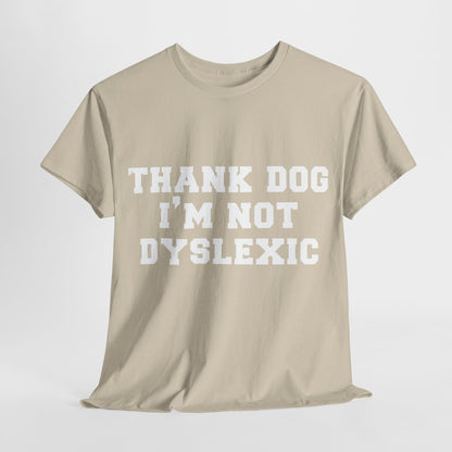 Luxury unisex cotton tee featuring the phrase 'THANK DOG I'M NOT DYSLEXIC' in bold uppercase sans-serif typography, perfect for stylish urban wear.
