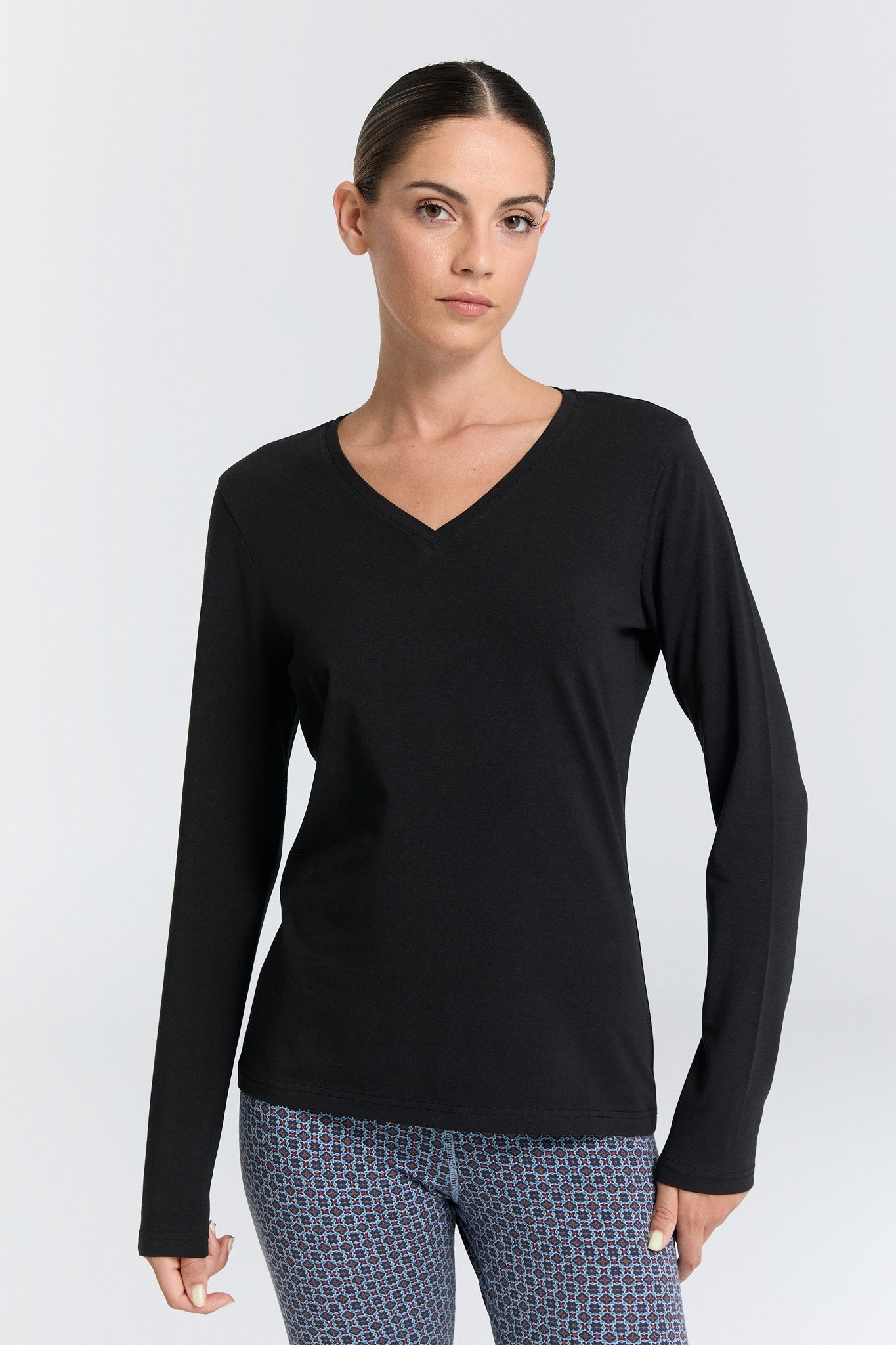 Detail shot of the Organic Cotton Stretch Long Sleeve V-Neck Top, showcasing the premium 95% organic cotton fabric that offers breathability and comfort.