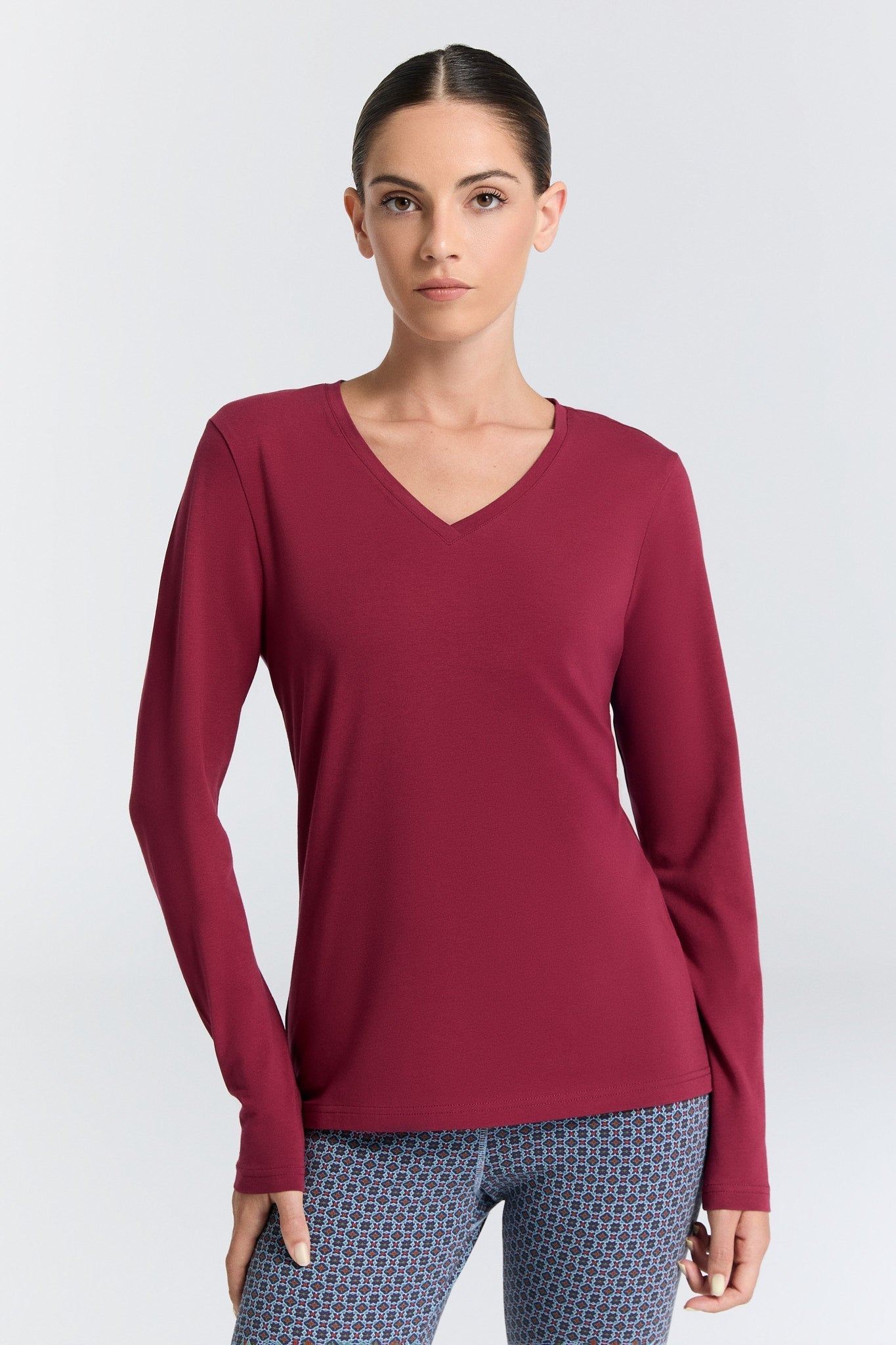 Luxurious organic cotton stretch long sleeve V-neck top for women, showcasing a flattering body-skimming silhouette.