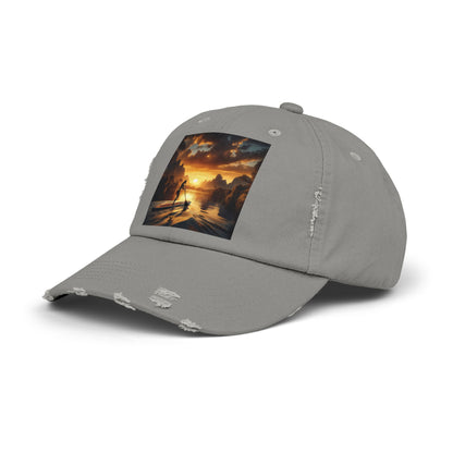 Unisex Distressed Paddleboarders Cap - A fashionable grey cap displaying a captivating paddleboarding sunset graphic, an essential accessory for luxury outdoor explorations.