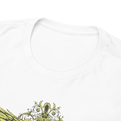 Close-up view of the collar and shoulder seam of an ornate men's t-shirt featuring a decorative cross and stylized wings design.