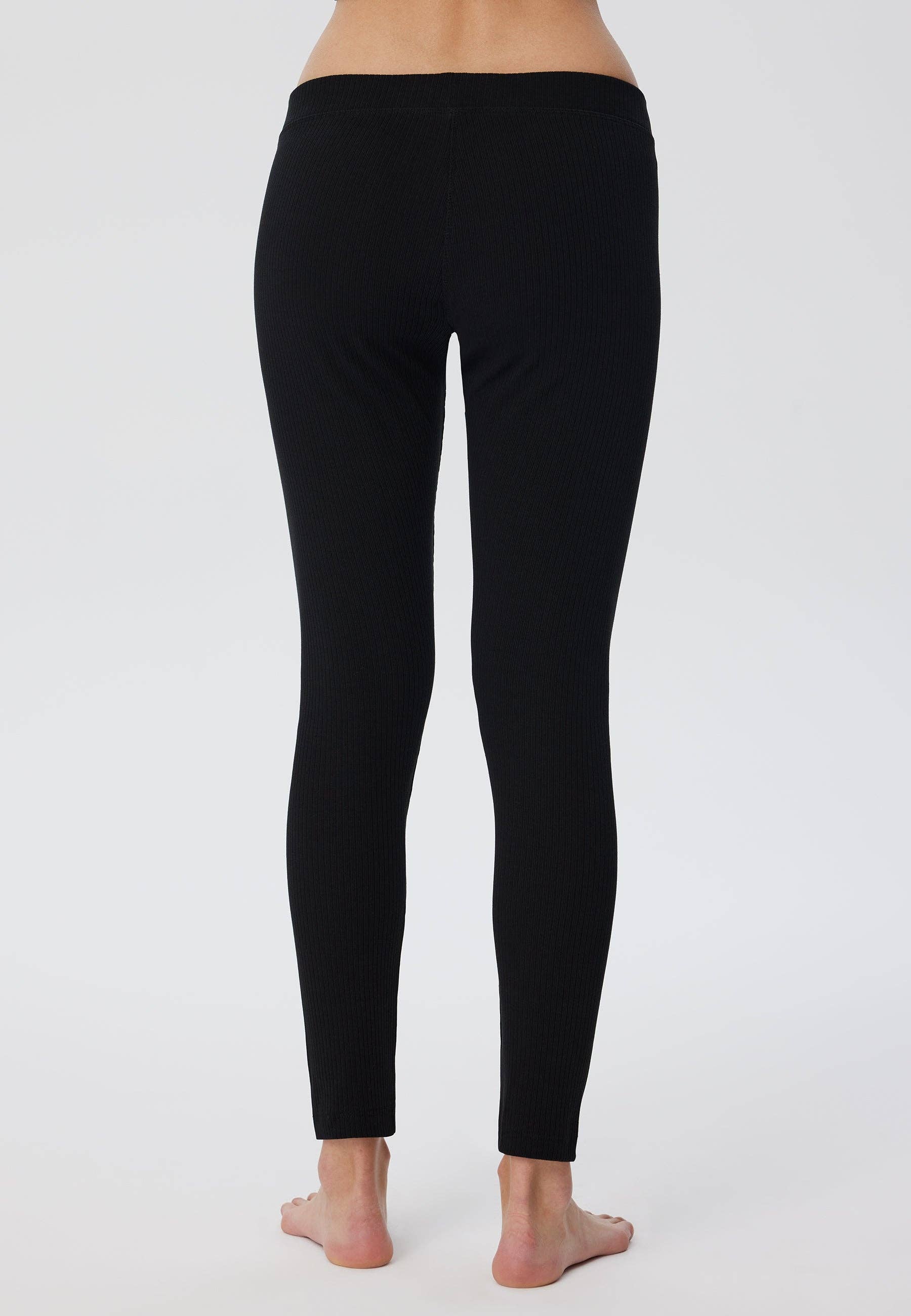 Fashion-forward women's ribbed leggings made of sustainable organic cotton, blending luxury with everyday wear.