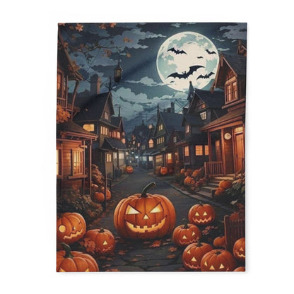 Decorative and Warm Halloween Spooky Arctic Fleece Blanket featuring a picturesque street adorned with carved pumpkins, a glowing full moon, and silhouetted bats, creating a charming and atmospheric Halloween scene.