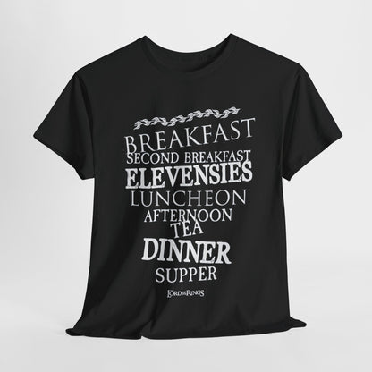 Elegant black graphic t-shirt featuring a whimsical design of hobbit meal times such as "BREAKFAST" and "SECOND BREAKFAST" in striking white font, embodying the charm of Lord of the Rings.