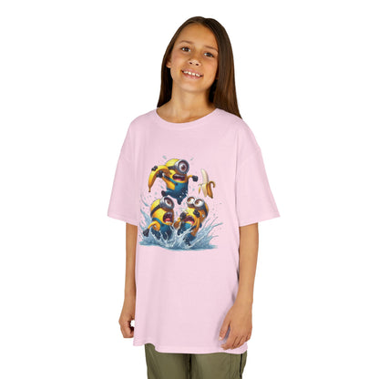 A young girl smiling while wearing a pink Minions T-Shirt with playful Minion graphics. This funny t-shirt captures the joyful spirit of Minions, making it a delightful piece for young fans of Despicable Me.