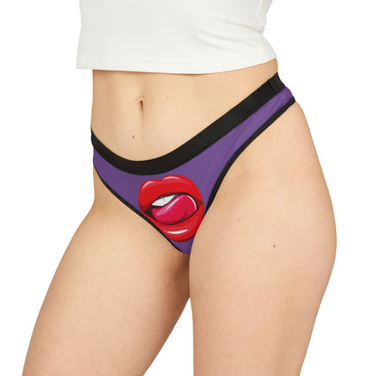 Fashionable model showcasing a luxurious purple thong with a cheeky red lips graphic, embodying playful romance and sophistication in women's lingerie.