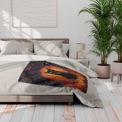 Elegantly displayed Decorative and Warm Halloween Spooky Arctic Fleece Blanket on a sophisticated bed, featuring an artistic black cat surrounded by autumn pumpkins.