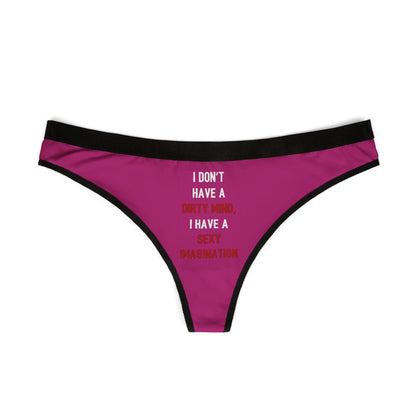 Chic women’s thong displayed flat, showcasing the humorous phrase 'I DON'T HAVE A DIRTY MIND, I HAVE A SEXY IMAGINATION' on a rich magenta background, ideal for special romantic moments.