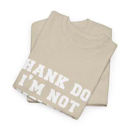 Elegant folded beige graphic tee showcasing the witty statement "THANK DOG I'M NOT DYSLEXIC" in striking white text, a versatile addition to any wardrobe.