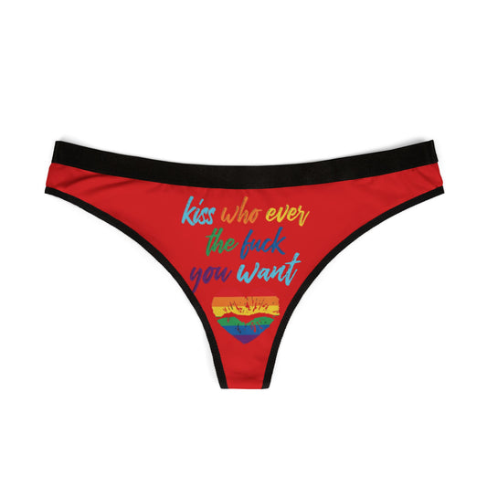 Stylish red women's thong displaying vibrant graphic letters saying 'Kiss who ever the fuck you want', ideal for adding a humorous touch to romantic occasions.