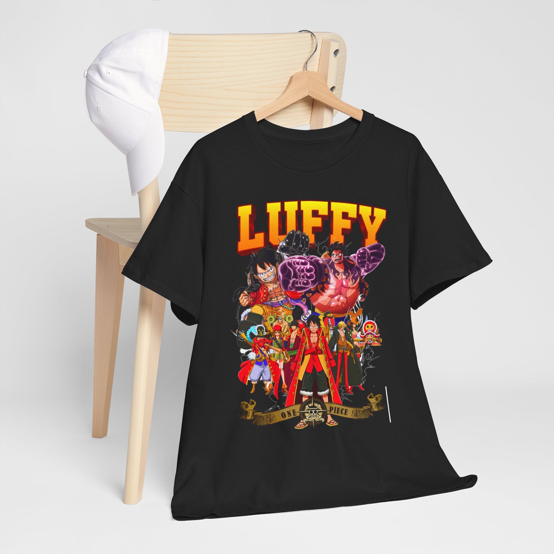 Luxurious black t-shirt draped over a chair, presenting an eye-catching One Piece design with Luffy, an ideal choice for casual elegance.