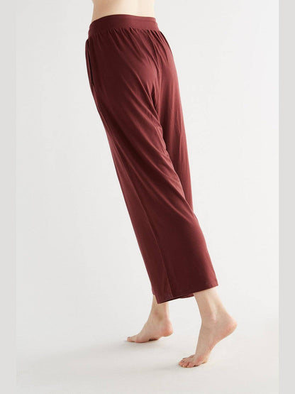 Elegant women's wide leg trousers made from luxurious TENCEL™ fabric, showcasing a soft, flowing silhouette perfect for chic, eco-conscious fashion.
