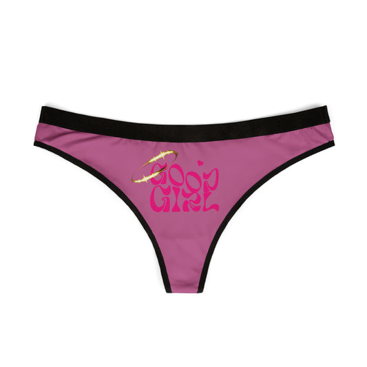 Chic pink thong panties with striking 'Good Girl' lettering and a radiant golden halo, exemplifying playful elegance.