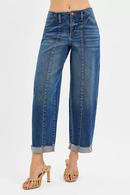 Stylish women's cuffed jeans with a high rise fit, showcasing a modern barrel design and elegant silhouette, perfect for a chic fashion statement.