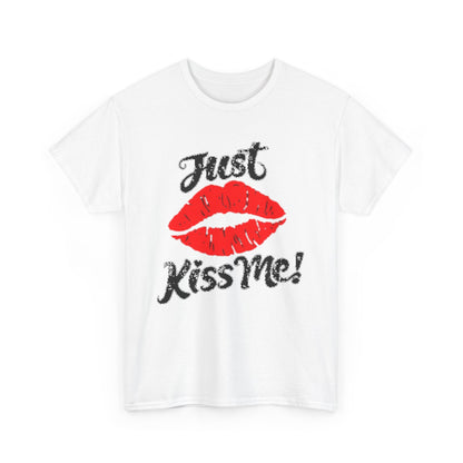 Luxurious unisex graphic t-shirt featuring a playful 'Just Kiss Me!' design with bold red lips on a white cotton fabric, perfect for adding a touch of whimsy to any casual ensemble.