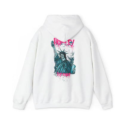 Luxurious white hoodie featuring a striking back graphic of a stylised Statue of Liberty, adorned with vibrant turquoise hues and bold pink graffiti text reading 'Liberty for ever'. A unique blend of urban artistry and contemporary fashion.