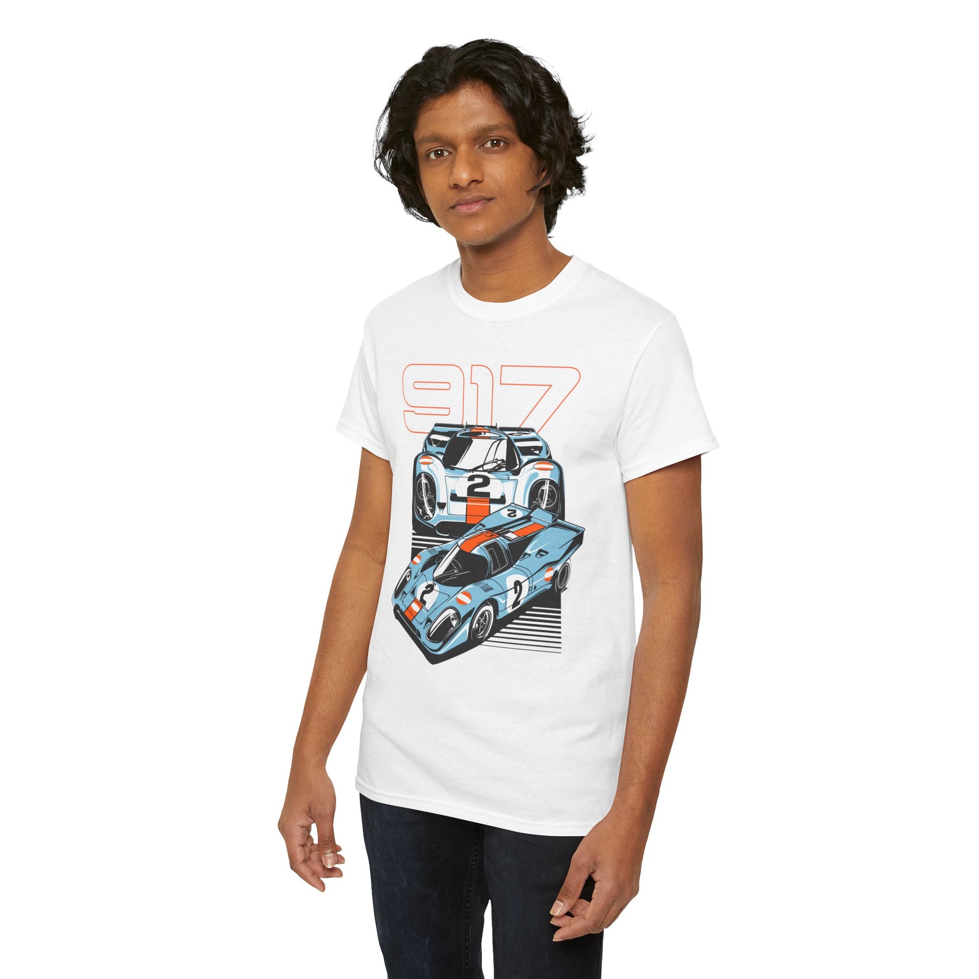 Young man wearing a Porsche 917 graphic t-shirt, presenting striking illustrations of race cars and '917' in an eye-catching design. Ideal for luxury streetwear.
