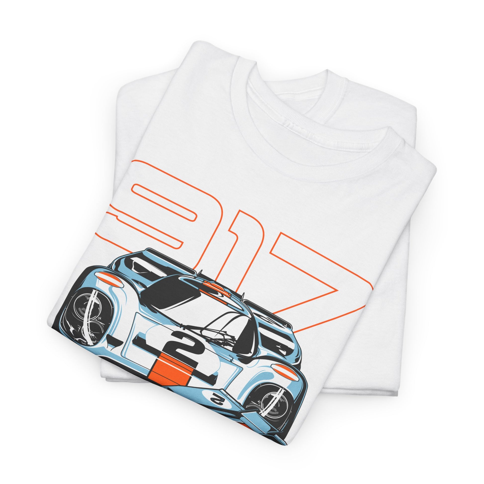 Stylish close-up of folded white Porsche 917 t-shirts featuring a striking graphic of the legendary race car, ideal for discerning car lovers.