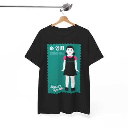 Chic black t-shirt emblazoned with a bold illustration of Young-Hee from Squid Game, elegantly displayed on a wooden hanger, highlighting its fashionable appeal.