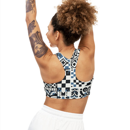 Side view of a model in the Lorelei Beaumont Checkerboard Sports Bra, showcasing the fashionable checkerboard design while demonstrating an active pose, ideal for luxury sportswear enthusiasts.