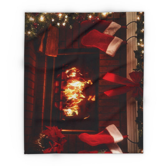 Luxury Christmas Arctic Fleece Blanket showcased by a glowing fireplace, surrounded by festive ornaments and stockings, perfect for creating a warm holiday atmosphere.