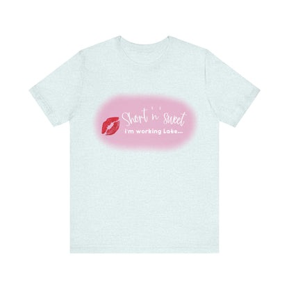 Sabrina Carpenter Inspired Unisex Short Sleeve Tee rendered in a soft light grey, featuring a charming lipstick print, epitomising luxury and style.