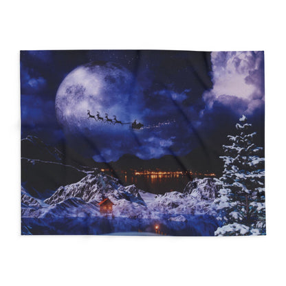 A beautiful Decorative and Warm Christmas Arctic Fleece Blanket featuring a picturesque winter scene with Santa Claus and reindeers flying across a moonlit night sky, perfect for adding a festive touch to your home decor.