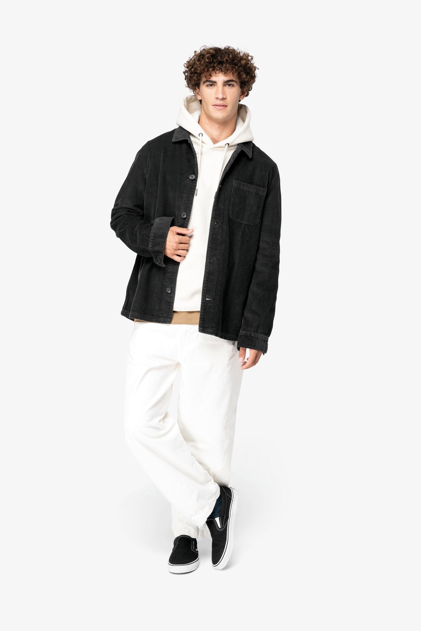 Elegant detail of the recycled plastic buttons on the organic cotton corduroy jacket, symbolising luxury and sustainability in modern fashion.