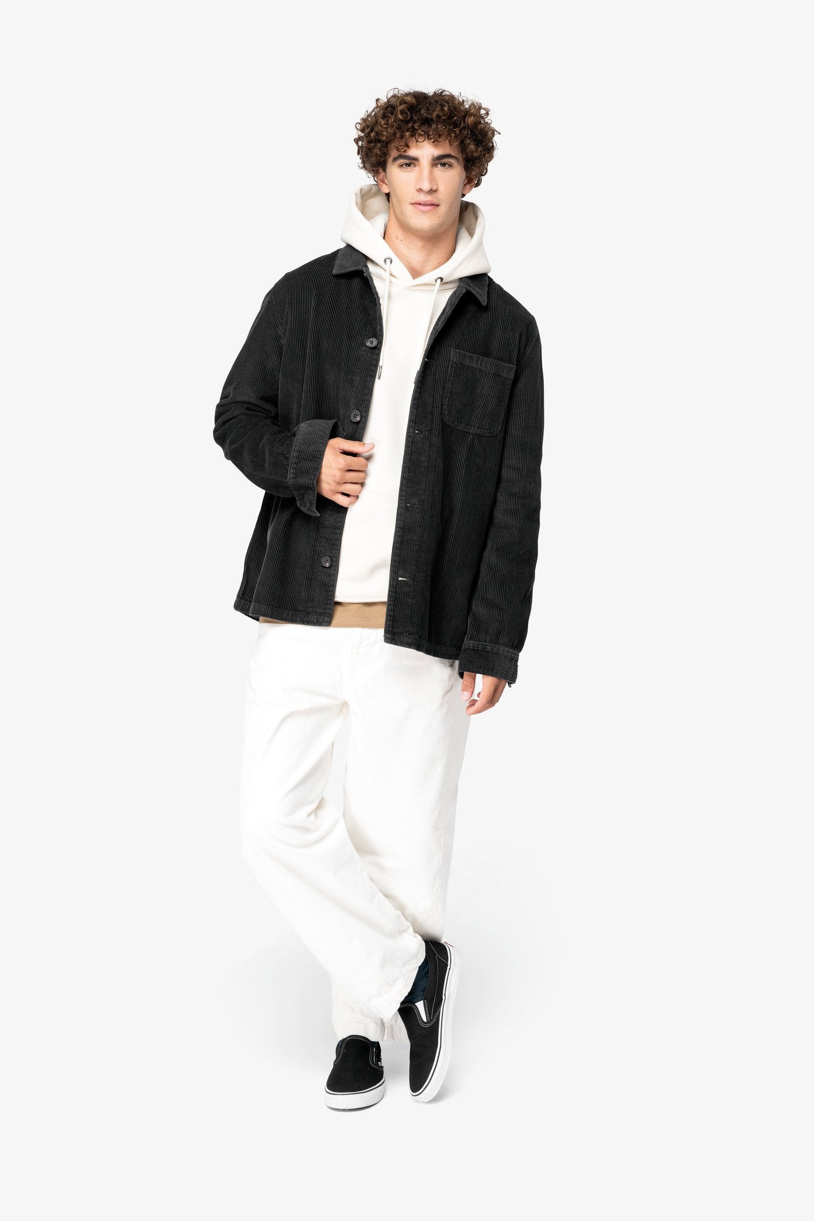 Elegant detail of the recycled plastic buttons on the organic cotton corduroy jacket, symbolising luxury and sustainability in modern fashion.