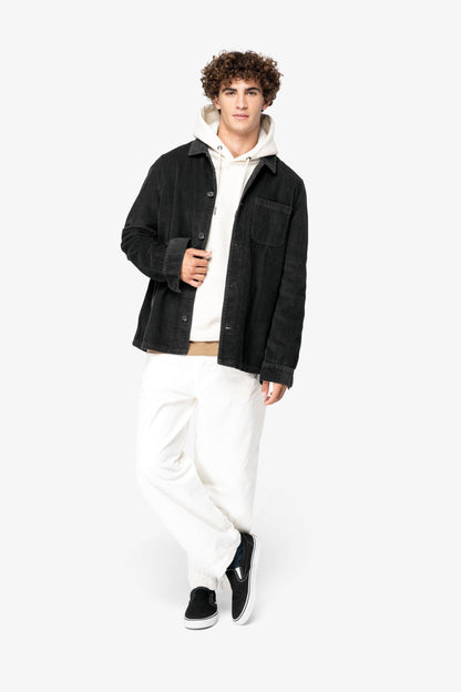 Elegant detail of the recycled plastic buttons on the organic cotton corduroy jacket, symbolising luxury and sustainability in modern fashion.